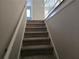 Carpeted staircase leading to the upper level at 2922 Eleanor Ter, Atlanta, GA 30318