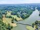 Aerial view showcasing the golf course community surrounding a lake at 1004 Fairway Seven, Villa Rica, GA 30180