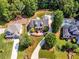 Aerial view of property featuring landscaping, mature trees and lush lawn at 1004 Fairway Seven, Villa Rica, GA 30180