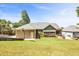 Spacious backyard featuring a basketball hoop and flagstone patio with fire pit at 1004 Fairway Seven, Villa Rica, GA 30180