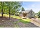 Backyard featuring a stone patio, and lush green lawn at 1004 Fairway Seven, Villa Rica, GA 30180