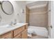 Cozy bathroom with a tiled shower over tub and a classic vanity featuring a sink and modern fixtures at 1004 Fairway Seven, Villa Rica, GA 30180