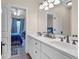 Bathroom with bright white cabinets and double vanity, connects to bedroom at 1004 Fairway Seven, Villa Rica, GA 30180