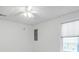 Bright bedroom featuring carpet floors, a ceiling fan, and a window with blinds for natural light at 1004 Fairway Seven, Villa Rica, GA 30180