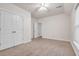 Neutral bedroom with a ceiling fan, carpet floors, closet and natural light from the window at 1004 Fairway Seven, Villa Rica, GA 30180