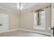 Clean room with a window, a ceiling fan, and neutral carpet at 1004 Fairway Seven, Villa Rica, GA 30180