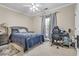 Bedroom featuring a window, ceiling fan, desk and dark wood night stand at 1004 Fairway Seven, Villa Rica, GA 30180