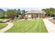 Clubhouse with manicured lawn and landscaping in a serene community setting at 1004 Fairway Seven, Villa Rica, GA 30180