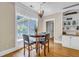Cozy dining area with hardwood floors, a chandelier, and a view of the outdoors at 1004 Fairway Seven, Villa Rica, GA 30180