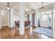 Dining room with wood floors, decorative columns, and large windows at 1004 Fairway Seven, Villa Rica, GA 30180
