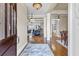 Inviting foyer with hardwood floors and stylish lighting fixtures, offering a glimpse into the living spaces at 1004 Fairway Seven, Villa Rica, GA 30180
