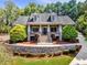 Charming two-story home with a stone retaining wall and meticulous landscaping at 1004 Fairway Seven, Villa Rica, GA 30180
