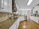 Spacious kitchen featuring granite countertops, white cabinets and stainless steel appliances at 1004 Fairway Seven, Villa Rica, GA 30180