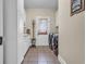 Laundry room with white cabinets, tile floors, and modern washer and dryer units at 1004 Fairway Seven, Villa Rica, GA 30180