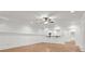 Bright and spacious living room featuring an archway, recessed lighting, decorative molding, hardwood floors and wainscotting at 1004 Fairway Seven, Villa Rica, GA 30180
