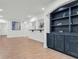 Living room with white walls, a built in bookcase, and modern decor at 1004 Fairway Seven, Villa Rica, GA 30180