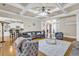 Open-concept living room with hardwood floors, stylish furniture, and access to the kitchen at 1004 Fairway Seven, Villa Rica, GA 30180