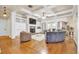 Spacious living room with hardwood floors, fireplace, and coffered ceilings at 1004 Fairway Seven, Villa Rica, GA 30180