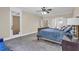 Spacious bedroom with neutral walls, carpet, ceiling fan, and natural light from large window at 1004 Fairway Seven, Villa Rica, GA 30180
