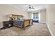 Large bedroom with a wooden bed frame, nightstands, and carpet flooring at 1004 Fairway Seven, Villa Rica, GA 30180
