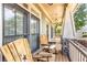 Relaxing front porch with rocking chairs and decorative pillars at 1004 Fairway Seven, Villa Rica, GA 30180