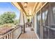 Charming porch featuring rocking chairs, stylish pillars, and relaxing ambiance at 1004 Fairway Seven, Villa Rica, GA 30180