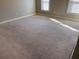 Large carpeted bedroom with sunlight streaming through windows at 2119 Gorman Se Grv # 126, Atlanta, GA 30316
