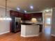 Modern kitchen with dark wood cabinets, stainless steel appliances, and an island at 2119 Gorman Se Grv # 126, Atlanta, GA 30316