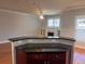 Kitchen island with granite countertop and seating area, overlooking living room at 2119 Gorman Se Grv # 126, Atlanta, GA 30316