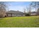 Large backyard features a well-maintained lawn and mature trees at 300 Huntington St, Covington, GA 30016