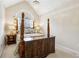 Cozy bedroom with vaulted ceiling, chandelier, and four-poster bed at 300 Huntington St, Covington, GA 30016