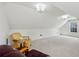 Spacious bonus room with neutral carpet and ample space for seating at 300 Huntington St, Covington, GA 30016
