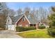 Attractive two-story house with a brick facade and attached garage at 300 Huntington St, Covington, GA 30016