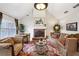 Bright living room with high ceiling, brick fireplace, and stylish decor at 300 Huntington St, Covington, GA 30016