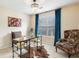 Well-lit office space with a unique desk, accent chair, and chandelier at 300 Huntington St, Covington, GA 30016