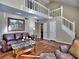 High ceiling living room with hardwood floors and loft view at 2095 Sand Wedge Nw Cir, Kennesaw, GA 30144