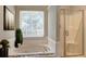 Bathroom with a large garden tub and a separate shower at 105 Ardenlee Dr, Peachtree City, GA 30269