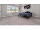 Simple bedroom with grey carpeting and large window at 1756 Evenstad Way, Smyrna, GA 30080