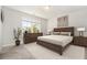 Spacious bedroom with large window and wood furniture at 1756 Evenstad Way, Smyrna, GA 30080