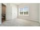 Spacious bedroom with plush carpeting and large window at 1756 Evenstad Way, Smyrna, GA 30080