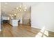 Bright dining room features hardwood floors and a stylish chandelier at 1756 Evenstad Way, Smyrna, GA 30080