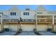 Three-unit townhome building with attached garages and decks at 1756 Evenstad Way, Smyrna, GA 30080