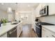 Modern kitchen with white cabinets, stainless steel appliances, and an island at 1756 Evenstad Way, Smyrna, GA 30080