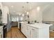 Modern kitchen with white cabinets, quartz countertops and gold fixtures at 1756 Evenstad Way, Smyrna, GA 30080