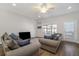 Spacious living room with hardwood floors, two sofas, and a TV at 1756 Evenstad Way, Smyrna, GA 30080