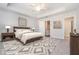 Large main bedroom with carpeted floor and ceiling fan at 1756 Evenstad Way, Smyrna, GA 30080