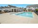 Community pool with adjacent clubhouse and seating at 1756 Evenstad Way, Smyrna, GA 30080