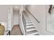 Modern staircase leading to the upper level at 202 College Cir # 1002, Hapeville, GA 30354