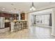 Kitchen features granite counters, dark wood cabinets, and breakfast bar at 2071 Cobblestone Ne Cir, Brookhaven, GA 30319