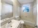 Bathroom with white tile, a bathtub, and a vanity with a white sink at 6257 Castlewood Dr, Morrow, GA 30260